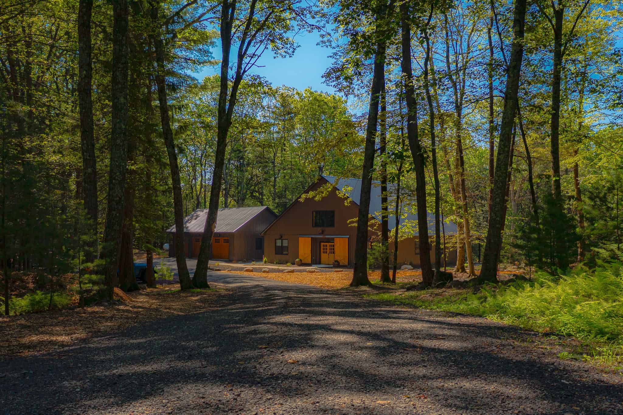 Residential buildings including barndominiums, garages, and post-frame homes built in Pennsylvania by Pioneer Commercial